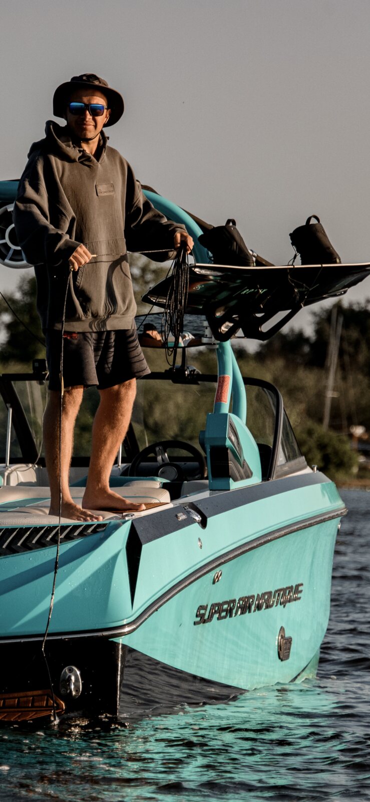 Roberts Linavskis aboard a wake boat